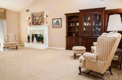 Spacious living room with a fireplace, built in sh