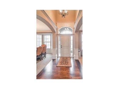 Grand foyer w vault ceiling and beautiful hardwood