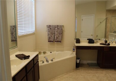 Large master bathroom with dual sinks and jacuzzi tub!