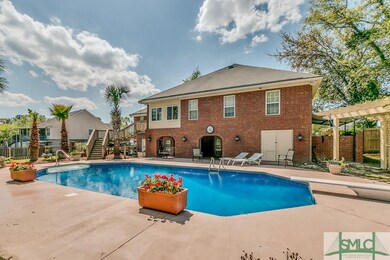 Back yard view of pool and back of home