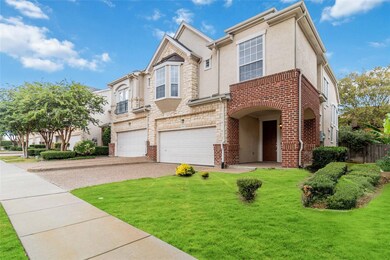 Multi unit property with a front yard and a garage