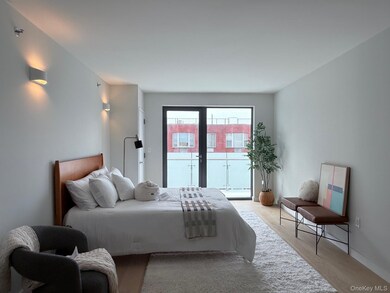 Bedroom with access to outside and light wood-type flooring