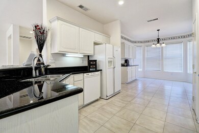 Kitchen upgraded with granite, white cabinets