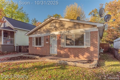 Bungalow-style house featuring brick siding