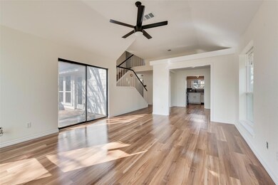 Unfurnished living room featuring lofted ceiling, 