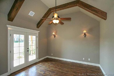 Beamed, vaulted ceiling with private porch