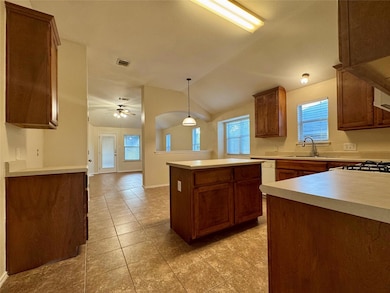 Kitchen with a kitchen island, plenty of natural 