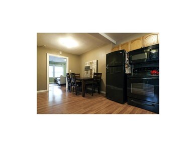 Kitchen features large eat-in dining area.