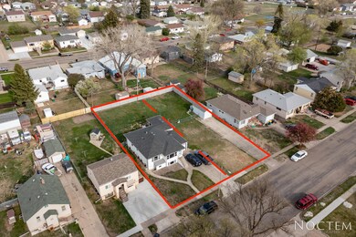 Duplex + 2 city lots