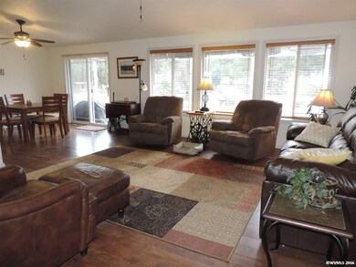 This living room has lots of light and windows.  w