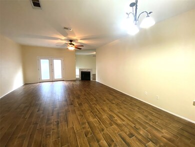The large living room features a decorative corner