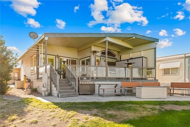 Rear view of property featuring a patio area
