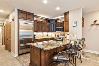 Kitchen featuring stainless steel appliances, a pe
