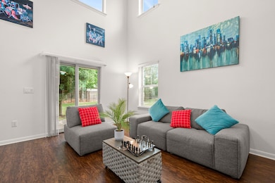 Living area with a high ceiling, plenty of natura