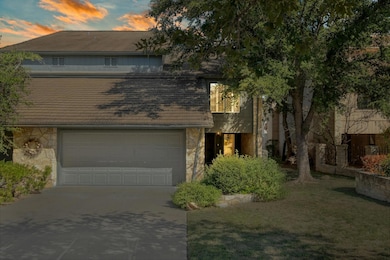 Traditional-style house featuring stone siding, c