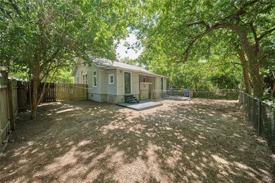 Rear view of property with a fenced backyard and 