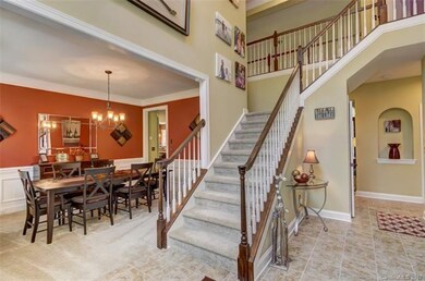 Foyer opens to formal dining room and executive of