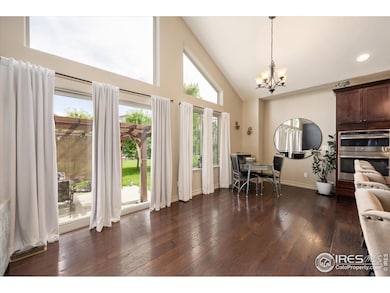 Large Windows Adorn the Space- Open to Kitchen Eating Area