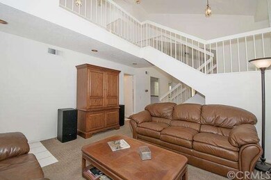 The stairway leads to an open loft and the bedroom