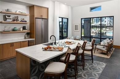 Kitchen featuring stainless steel refrigerator, a 