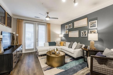 Living room featuring ornamental molding, ceiling 