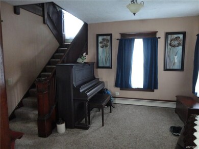 Open, traditional entrance foyer and open stairway of oak is a great space!