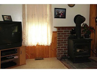 Living Room. Wood stove on brick hearth