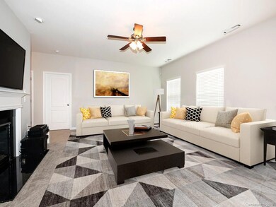 Virtual staging of main level family room with furniture