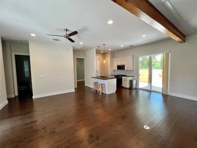 Unfurnished living room with attic access, ceilin