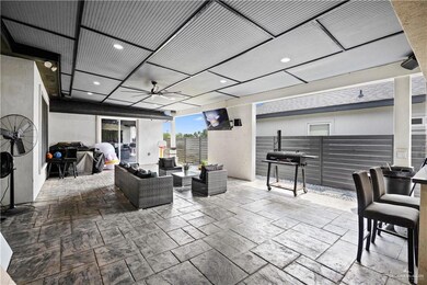 View of patio / terrace featuring a ceiling fan, an outdoor living space, and grilling area