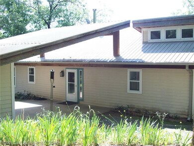 back of home drove way and carport
