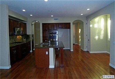 Kitchen includes center island with breakfast bar 