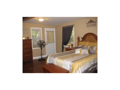 Master bedroom with outside entrance to covered po
