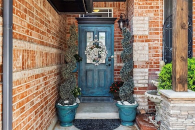 Entrance to property with brick siding