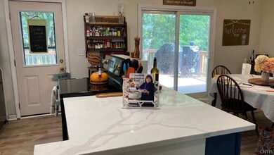 The door in the back was necessary to get out to the deck without going around the wall.