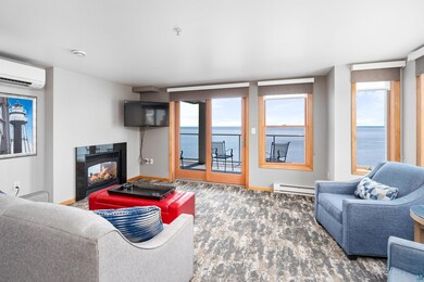 Living room with a baseboard heating unit, a wealt
