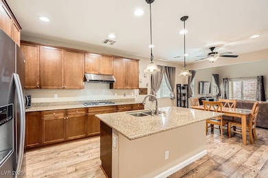 Spacious kitchen with granite island, maple cabine
