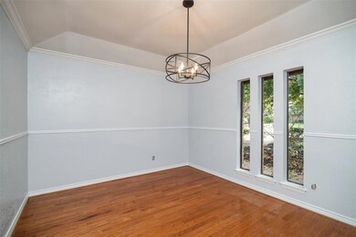 Formal dining room with updated light fixture.
