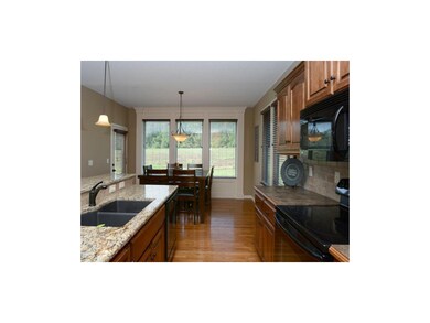 Kitchen flows into the breakfast area.