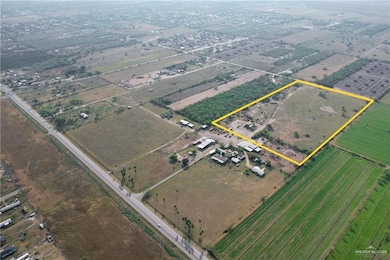 Birds eye view of property with a rural view