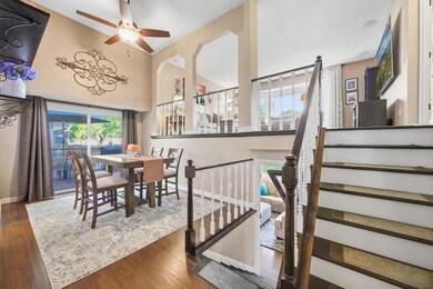 The dining room provides access to a side deck, creating a seamless indoor–outdoor flow.