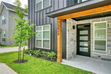 Doorway to property featuring board and batten sid