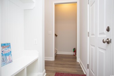 Mudroom with dark wood-type flooring