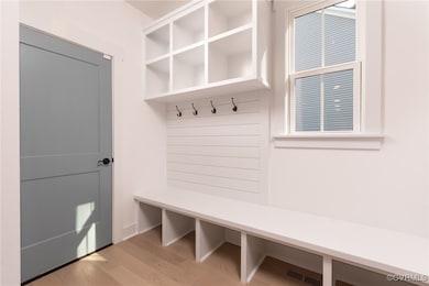 Mudroom with light hardwood / wood-style flooring
