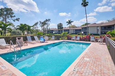 Pool with a paver patio and fenced