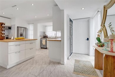 Kitchen featuring light tile patterned flooring, w