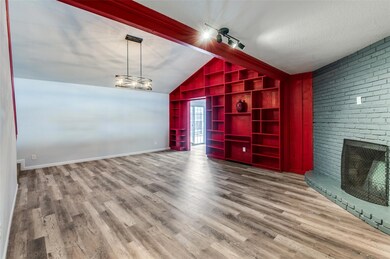Unfurnished living room with an inviting chandelie