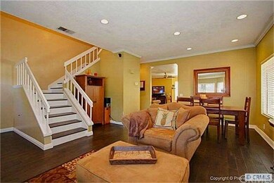Open floor plan combines living room and formal di