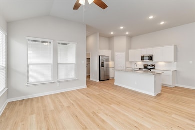 Kitchen featuring stainless steel appliances, a s