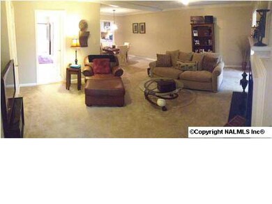 Sit back and relax in this warm, inviting family room and enjoy the coziness of the fireplace with granite hearth
